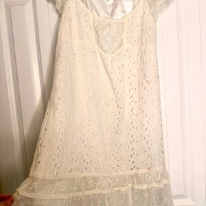 Empire waist, off-white eyelet lace dress. Found in a vintage shop.